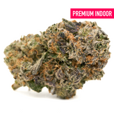 Vibrant cannabis bud with orange hairs and purple hues from Candy Rain Indoor THCa Flower