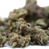 Mega Gummie Bearz THCa flower smalls: green and orange buds with resin coating