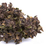 Close-up of purple and green cannabis bud with trichomes and orange pistils for After Dark Indoor THCa Flower Wholesale