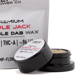 Black cylindrical container with white label holding 5 gram apple jack thca crumble wax hemp flower product