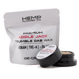 A sleek black container with white label holding 5 gram apple jack thca crumble wax from hemp flower co