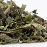 Dried green bahama bussdown greenhouse thca trim with textured earthy hemp flower for wholesale use