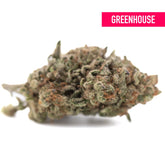 Dense green and brown bahama bussdown hemp flower bud with frosty white trichomes greenhouse thca coating