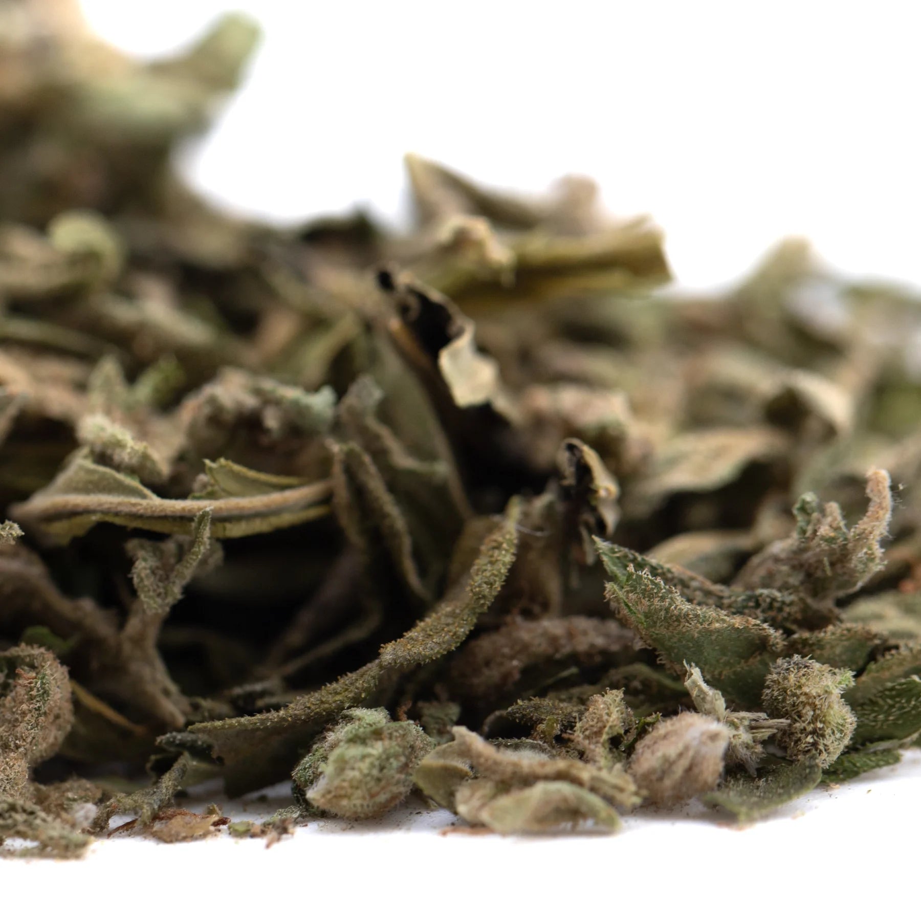 Dried mint leaves with a soft fuzzy texture in muted green color featured in banana og full-term thca shake trim wholesale