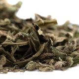 Dried mint leaves with a soft fuzzy texture in muted green color featured in banana og full-term thca shake trim wholesale