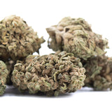 Dried banana og full-term thca flower buds with dense trichomes and greenish-brown hues premium thca flower