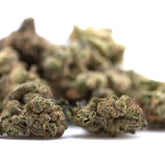 Banana og’s full-term thca flower smalls with green and brown hemp buds and a textured frosty surface