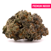 Blue Heron THCa Flower showcasing dense cannabis bud with trichomes and orange hairs