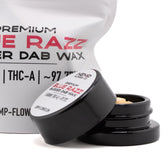 Black plastic jar of light-colored blue raz thca premium thca budder wax 5 gram container with white label and lid