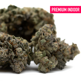 Dense cannabis buds with trichomes from Butter OG Indoor THCa Flower Wholesale, showcasing mysterious genetics and indoor cultivation