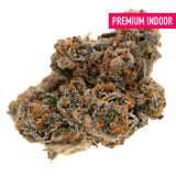 Cadillac Rainbow THCa Flower with dense trichomes, orange pistils, dark green leaves