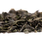 Dried dark green loose-leaf tea with Girl Scout Cookies, THCA trim, and hemp flower
