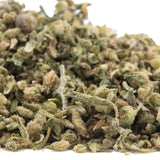 A pile of green and brown dried cbg hemp flower buds covered in fine trichomes labeled cbg #2 hemp flower trim full-term