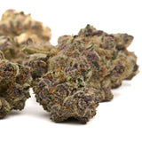 Dried purple-tinged Cereal Milk Indoor THCa Flower buds covered in trichomes