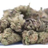 A dense green and purple tinged chicken and waffles thca greenhouse smalls bud with a textured surface
