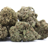 Dried cola full-term thca flower buds with dense textured surface greenish-brown hues and rich terpene profile