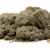 A mound of fine textured cream caramel thca kief in muted olive green from hemp flower product full-term