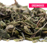 Dried daily grape greenhouse thca trim hemp flower buds with green and brown hues covered in fine trichomes