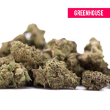 A pile of dense green and brown deep space hemp flower buds with frosty texture and knockout genetics wholesale smalls