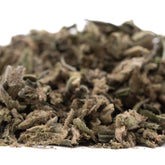 A pile of dried green and brown dirty laundry full-term thca trim buds showcasing the terpene profile