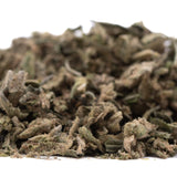 A pile of dried green and brown dirty laundry full-term thca trim buds showcasing the terpene profile