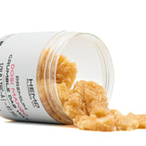 Dosi Mango THCA Crumble Wax in clear plastic jar, golden-brown cannabis crumble