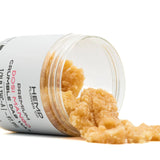 Dosi Mango THCA Crumble Wax in clear plastic jar, golden-brown cannabis crumble
