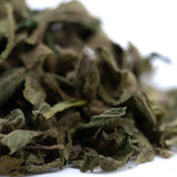 Dried mint leaves with textured surface and varying green shades in emerald fire’s premium full-term thca trim wholesale