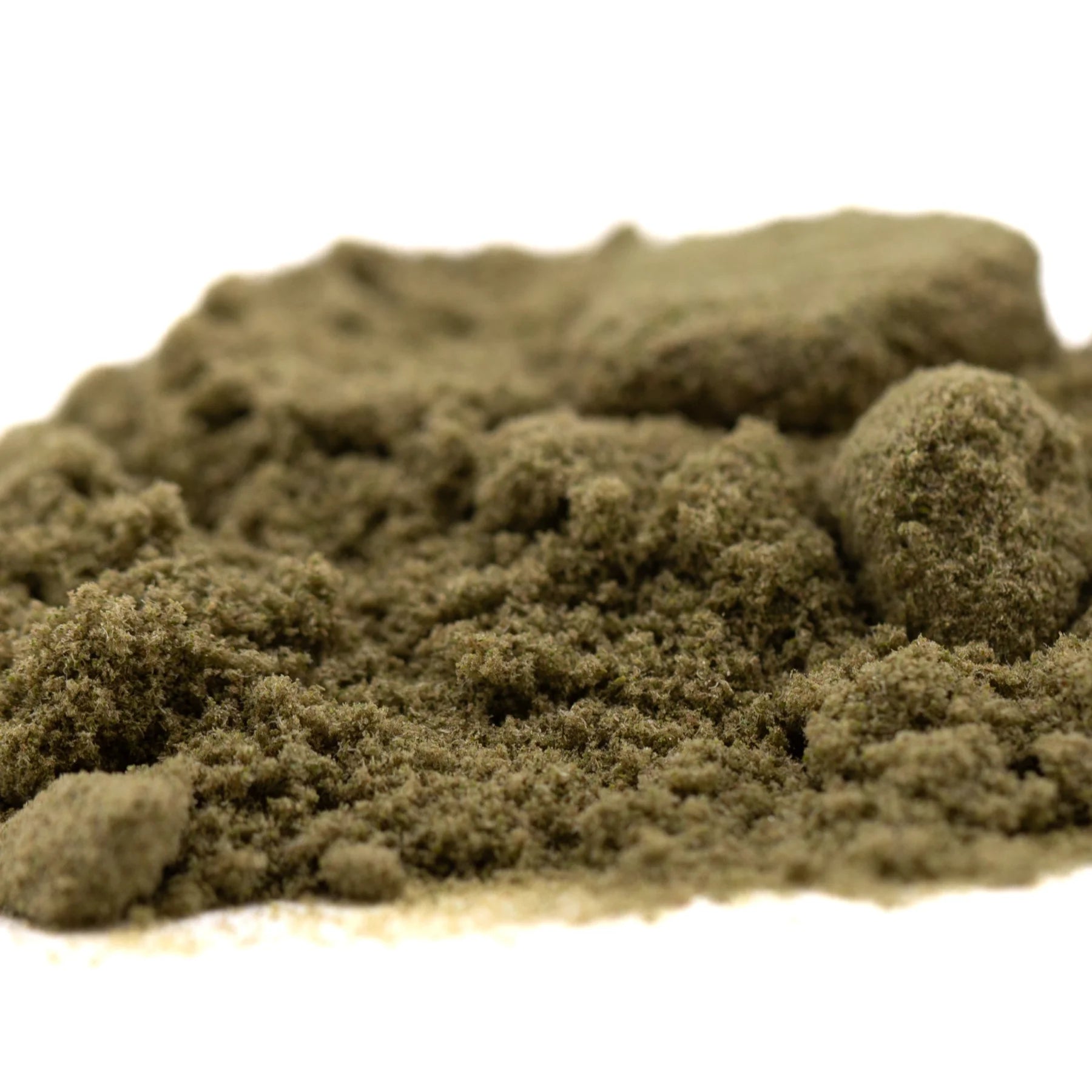 A mound of fine earthy green thca kief full-term from dark heart nursery sour lemon-lime strain with granular texture