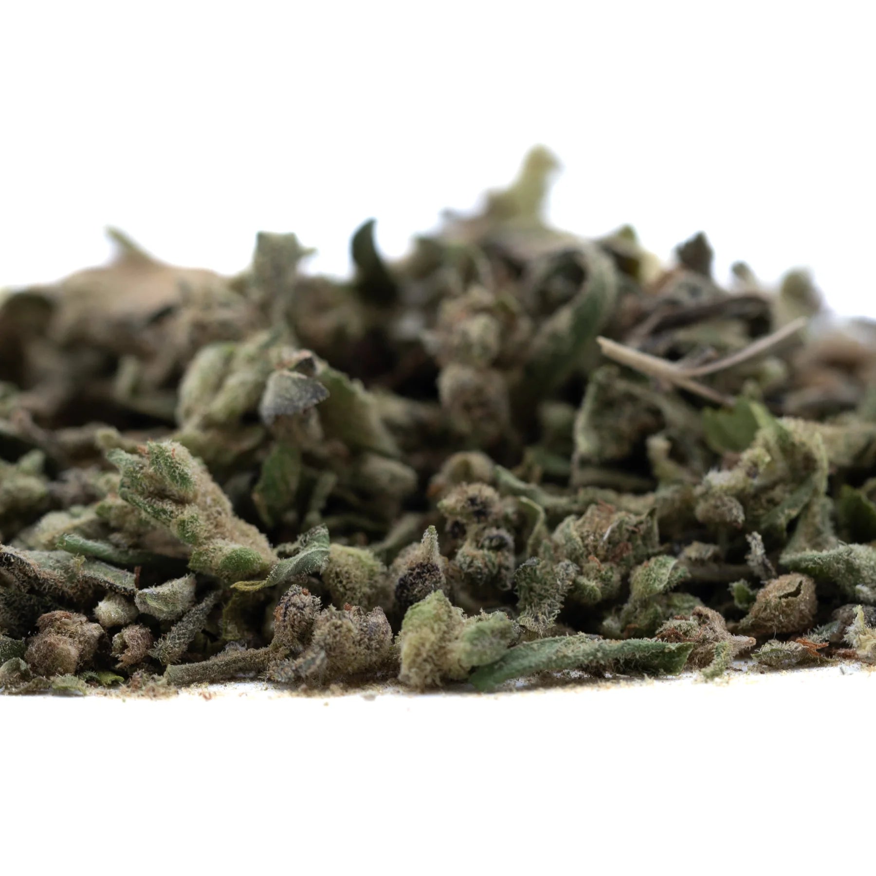 A pile of dried greenish gray fog dog trim thca hemp flower with a textured slightly fuzzy surface