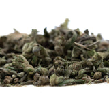 A pile of dried greenish gray fog dog trim thca hemp flower with a textured slightly fuzzy surface
