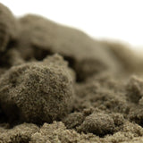 A mound of coarse beige fog dog kief showcasing the concentrated potency of hemp flower texture