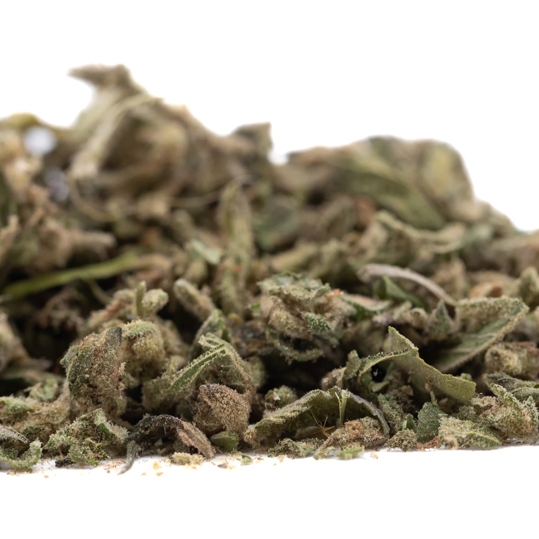 A pile of dried cannabis buds in green brown and beige hues from froot by the foot full-term thca trim wholesale for mental clarity