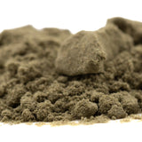 A mound of fine olive green thca kief sand from froot by the foot thca kief full-term by auto genetics nostalgic candy character