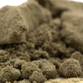 A mound of textured green artificial moss clumps from froot by the foot thca kief hemp flower for therapeutic mood enhancement