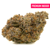 Georgia Pie indoor THCa flower with dense trichomes, orange hairs, and purple hues