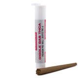 White cylindrical tube labeled giggle gas thca containing 1 gram hemp flower thca pre rolls with 30.81 percent thc content