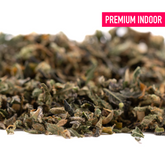 Dried shredded green herbs from Granny Crack Indoor THCa Trim Wholesale 1LB featuring Green Crack and Sour Apple strains by Purple City Genetics