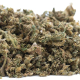 A dense pile of hempress cbd hemp flower buds with green and brown hues highlighting cannabinoid potency trim wholesale
