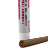 A white cylindrical tube labeled flower co hooch 30.16 percent thca pre-rolls with aromatic complexity and physical relaxation
