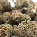 Lush dense humboldt dream thca flower hemp buds with green and orange hues from greenhouse smalls collection