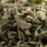 Dried jelly donut full-term thca trim with green and brown hues and white trichomes for deeply relaxing scout cookies and louis xiii effects