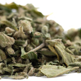 A pile of dried greenish-gray jelly donut full-term thca trim with a slightly fuzzy texture for deeply relaxing use