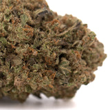 Dense textured jokerz nos thca hemp flower with green and brown hues similar to jet fuel and white runtz thca flower