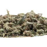 A pile of mega gummie bearz thca trim hemp flower buds with green and brown hues covered in white trichomes