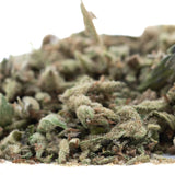 A pile of mega gummie bearz thca trim hemp flower buds with green brown and white trichomes for wholesale use