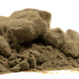 A mound of earthy-brown kinetic sand representing the therapeutic spectrum in mega gummie bearz authentic gummy product