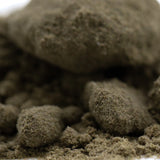 A pile of dark brown coarse textured granules of mendo breath thca kief cult classic full term for cannabis use