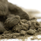 A pile of coarse earthy brown mendo breath hemp flower buds with a fibrous surface for cult classic thc kief use