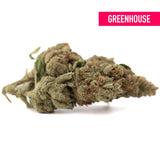 A dense green moroccan peach’s thca hemp flower with trichomes and orange pistils from greenhouse lemon tree skorange